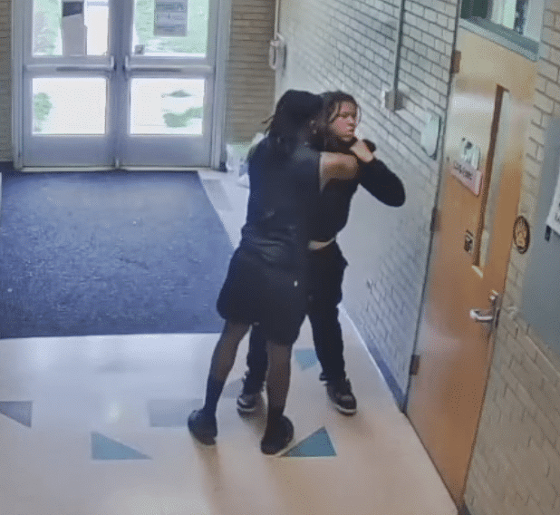 Coach caught choking student