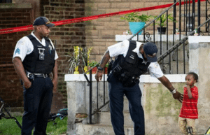 Decomposing Infant Found in Playpen as Twin Fights for Survival